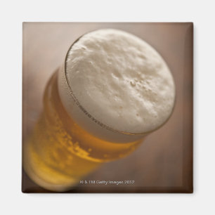 A pint of lager, back lir shallow focus rustic magnet