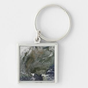 A pinwheel-like pattern of high pressure clouds key ring