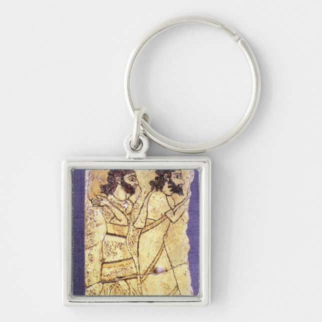 A plaque depicting two men walking key ring (Front)