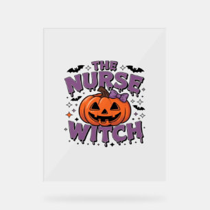 A playful design featuring a pumpkin witch with a  acrylic sign