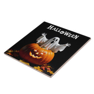 A playful ghost emerges from a carved pumpkin ceramic tile