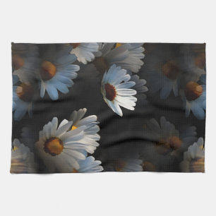 A Plethora Of Floating Daisies Isolated On Black Tea Towel