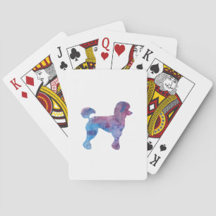A poodle playing cards