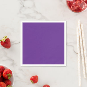 a purple background with a white border napkin