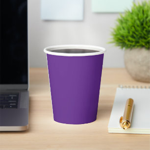 a purple background with a white border paper cups