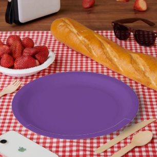 a purple background with a white border paper plate