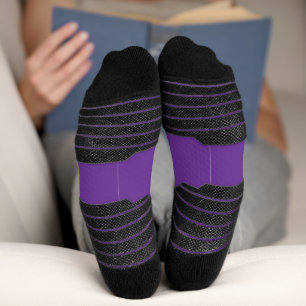a purple background with a white border socks