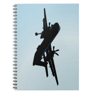 A Q400 turboprop airliner on approach to land Notebook