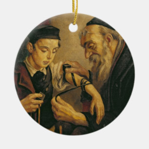 A Rabbi tying the Phylacteries to the arm of a boy Ceramic Ornament