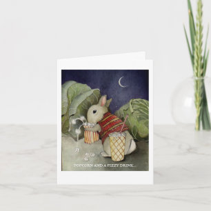 A rabbit enjoys a snack card