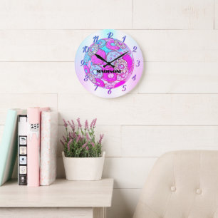 A rainbow of colours, a pink doughnut with a name  large clock