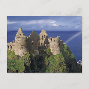 A rainbow strikes mediaeval Dunluce Castle on Postcard