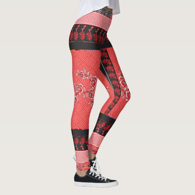 a red and black pattern with flowers on it leggings (Right)
