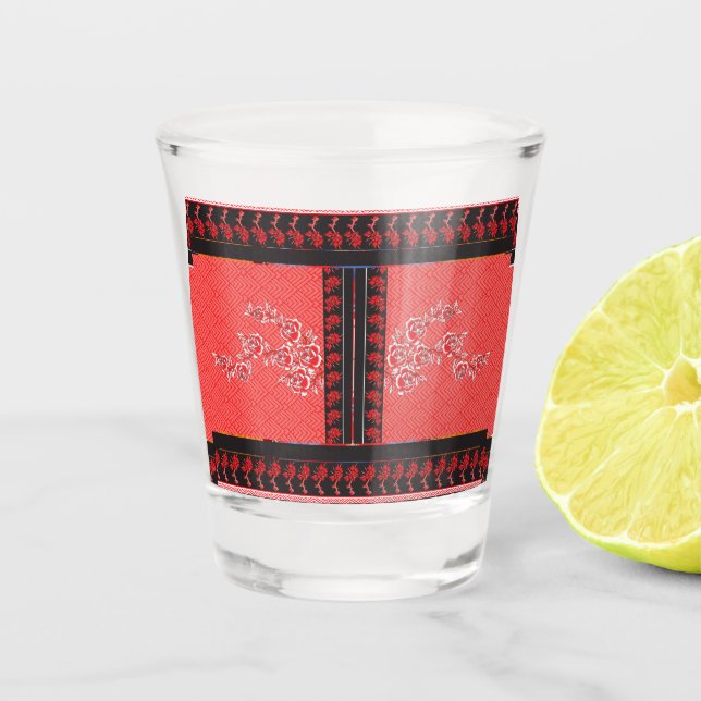 a red and black pattern with flowers on it shot glass (Front)