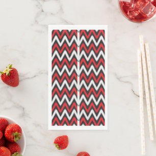 a red and black zigzag pattern on a white backgrou napkin