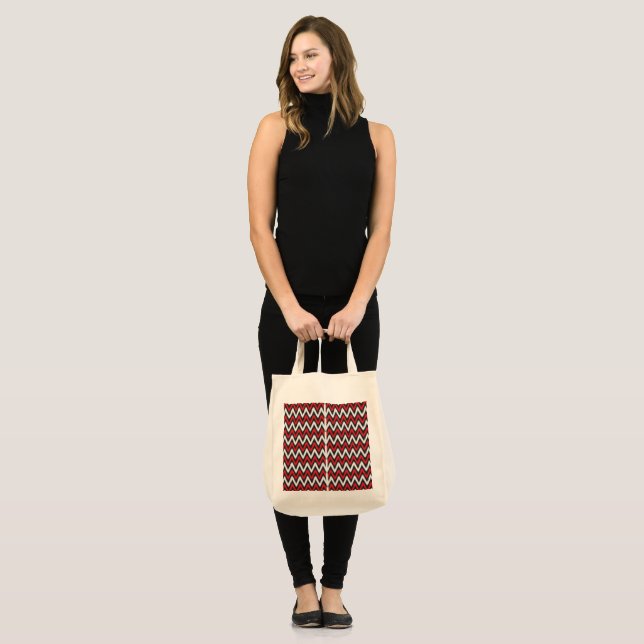 a red and black zigzag pattern on a white backgrou tote bag (Front (Model))