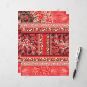 a red and green floral design on a black backgroun