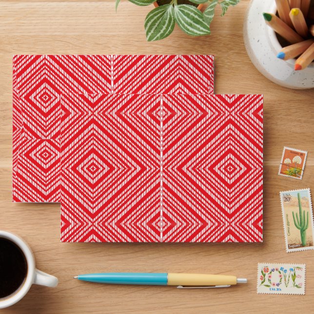 a red and white background with a diamond pattern envelope (Desk)