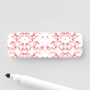a red and white background with a pattern name tag