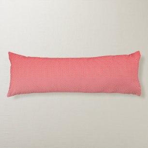 a red and white background with small squares body cushion
