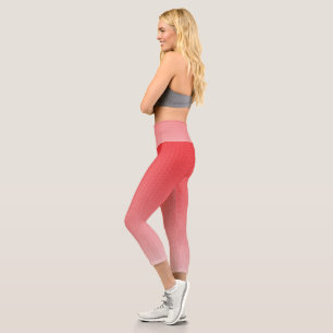 a red and white background with small squares capri leggings