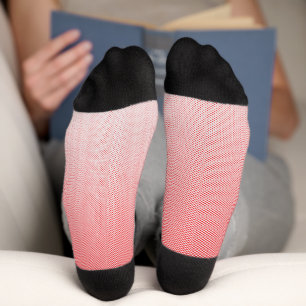 a red and white background with small squares socks