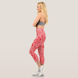 a red and white image of a pattern on a white back capri leggings