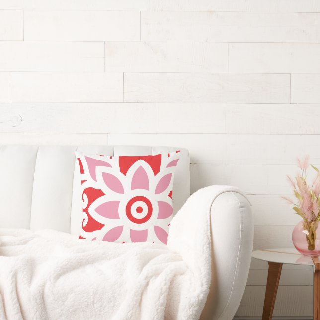 a red and white pattern with a flower on it cushion (Couch)