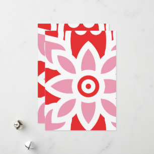 a red and white pattern with a flower on it holiday card