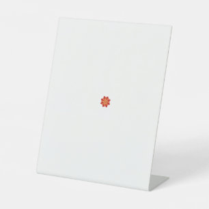 a red and yellow flower with black dots pedestal sign