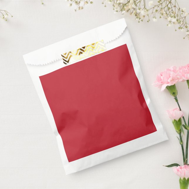 a red background with a favour bag (Sealed)
