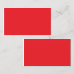 a red background with a white border calling card