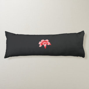 a red flower on a black background body cushion