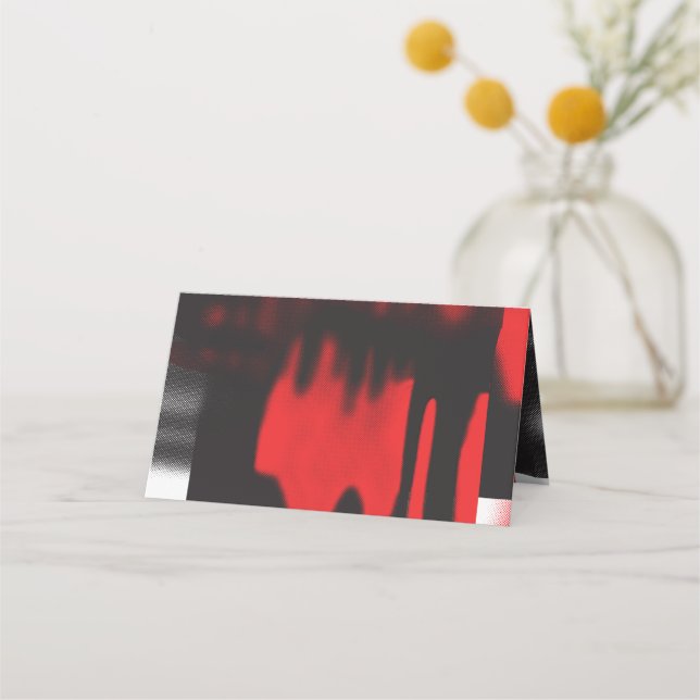 A red graphic design featuring bold geometric shap place card (Front)