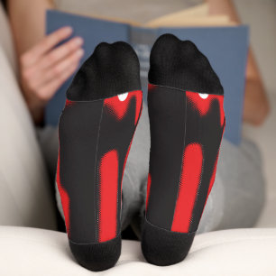 A red graphic design featuring bold geometric shap socks