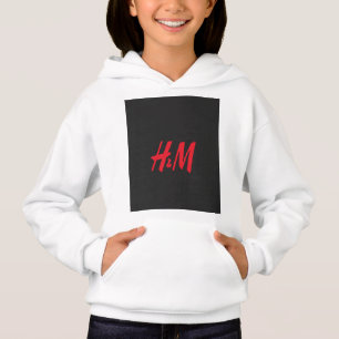 a red h and m logo on a black background