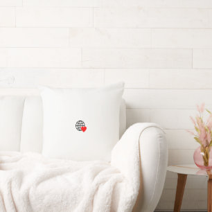 A red heart symbol created with smooth, bold lines cushion