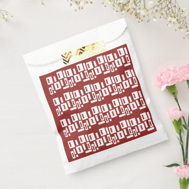 A red rug with a textured pattern is spread out on favour bag (Sealed)