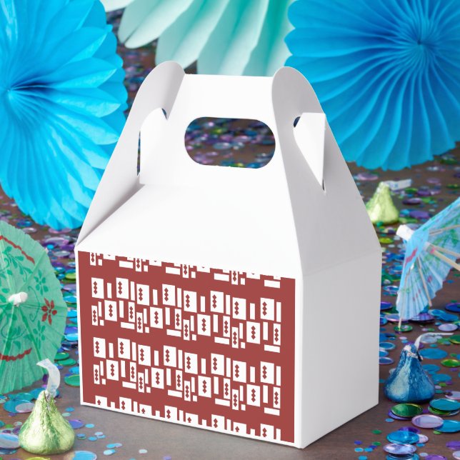 A red rug with a textured pattern is spread out on favour box (Party)