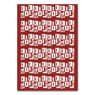 A red rug with a textured pattern is spread out on table number