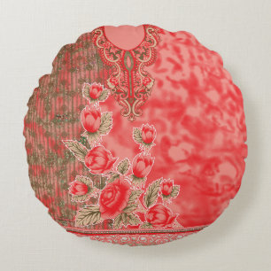 a red scarf with flowers on it round cushion