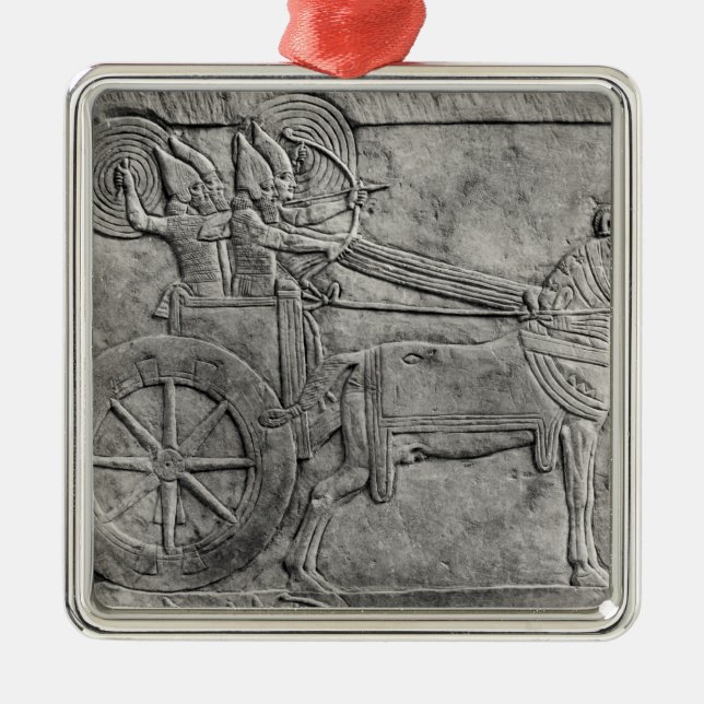 A relief depicting the Assyrian army in battle Metal Ornament (Front)