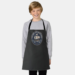 A retro Columbus Day emblem with a caravel ship Apron
