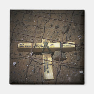 A road repair crew places a cross magnet