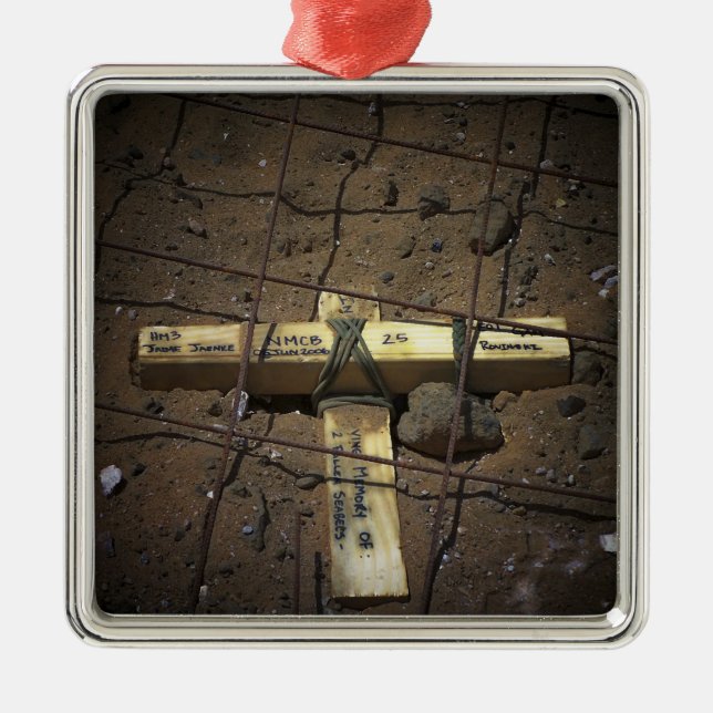 A road repair crew places a cross metal tree decoration (Front)