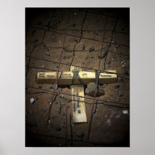 A road repair crew places a cross poster