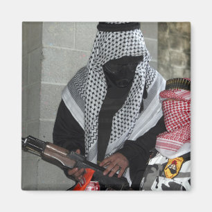 A role-playing enemy aggressor arms a dummy magnet