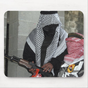 A role-playing enemy aggressor arms a dummy mouse pad