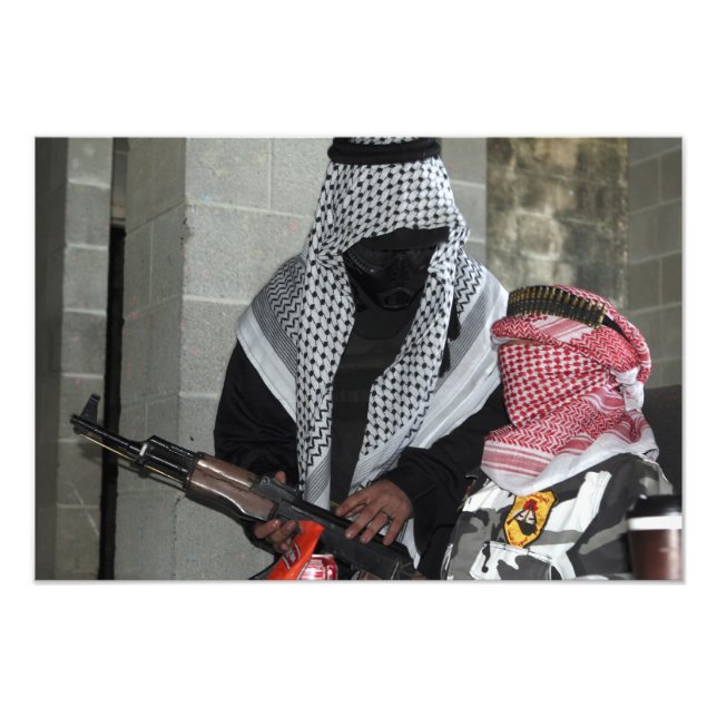 A role-playing enemy aggressor arms a dummy photo print (Front)