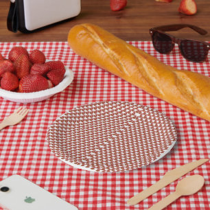 A rolled-up piece of wrapping paper with a festive plate